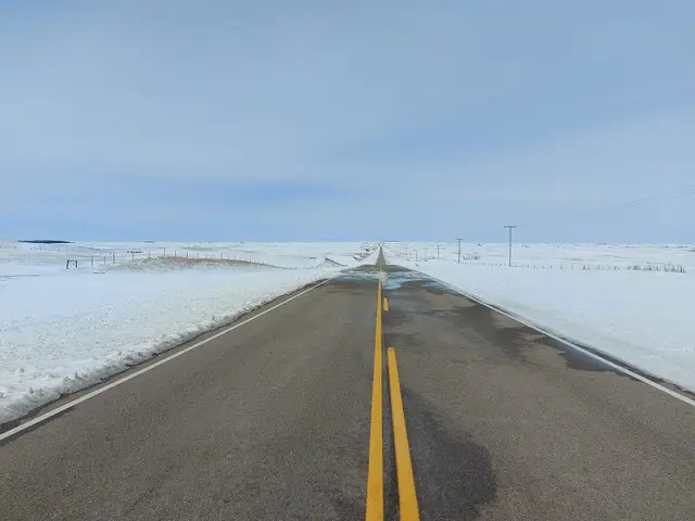 Highway 18 across snowy prairie